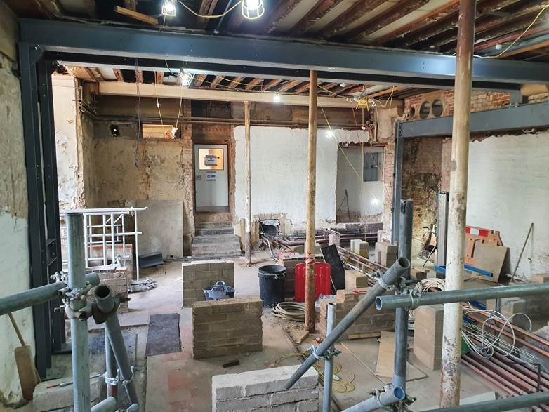 The old kitchens are still in the process of being transfomed into a new servery and dining hall, however the new steel work is now in place and services are being installed