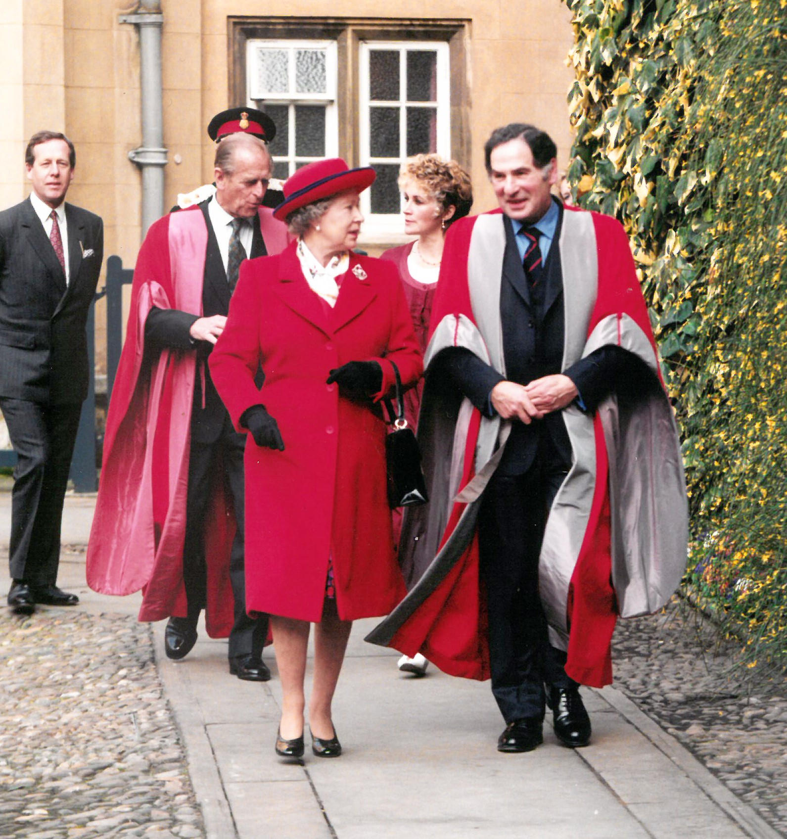 Her Majesty The Queen walking through Hall Court