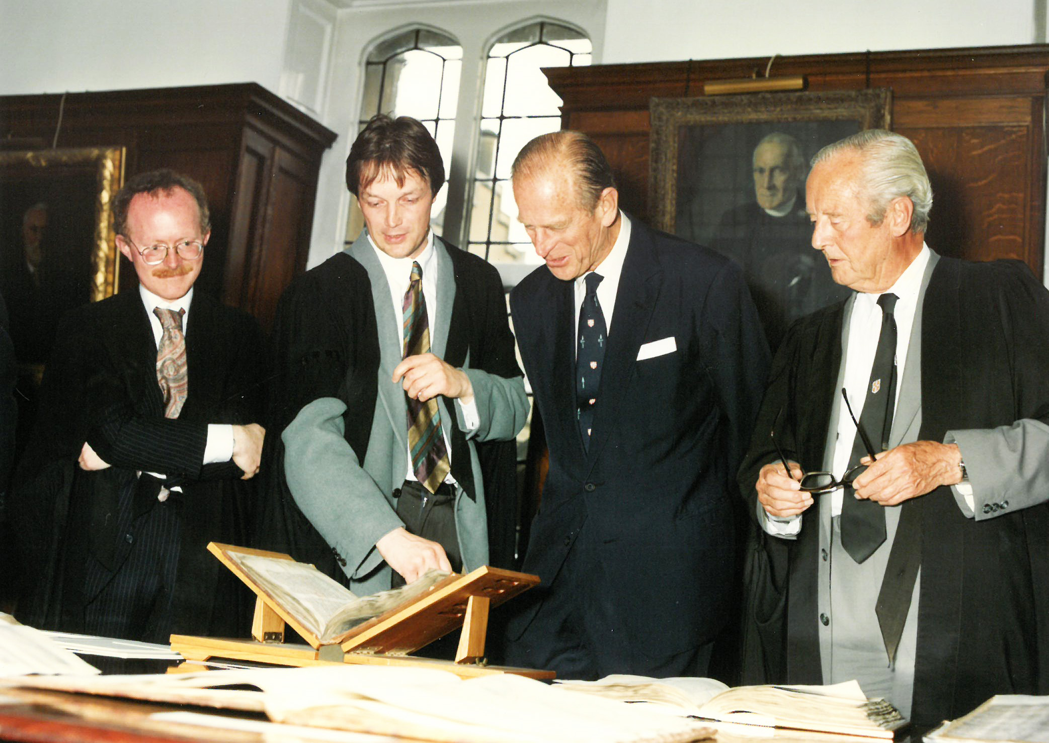 The Duke of Edinburgh visiting Sidney and looking a book alongside three others