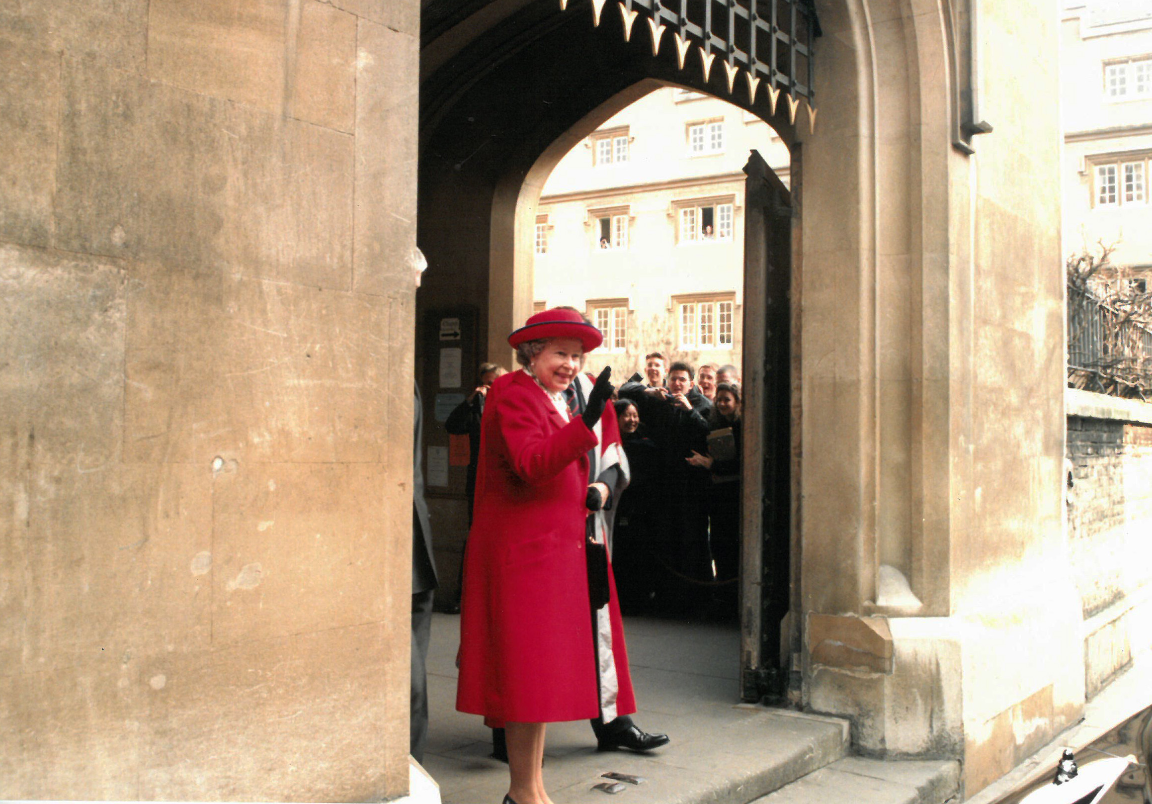 The Queen arriving at Sidney Sussex College and waving from the steps at the front of College